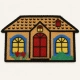 Felpudo forma de casa con diseño colorido en fibra de coco