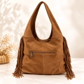 Bolso de hombro efecto ante con flecos en color camel y burdeos
